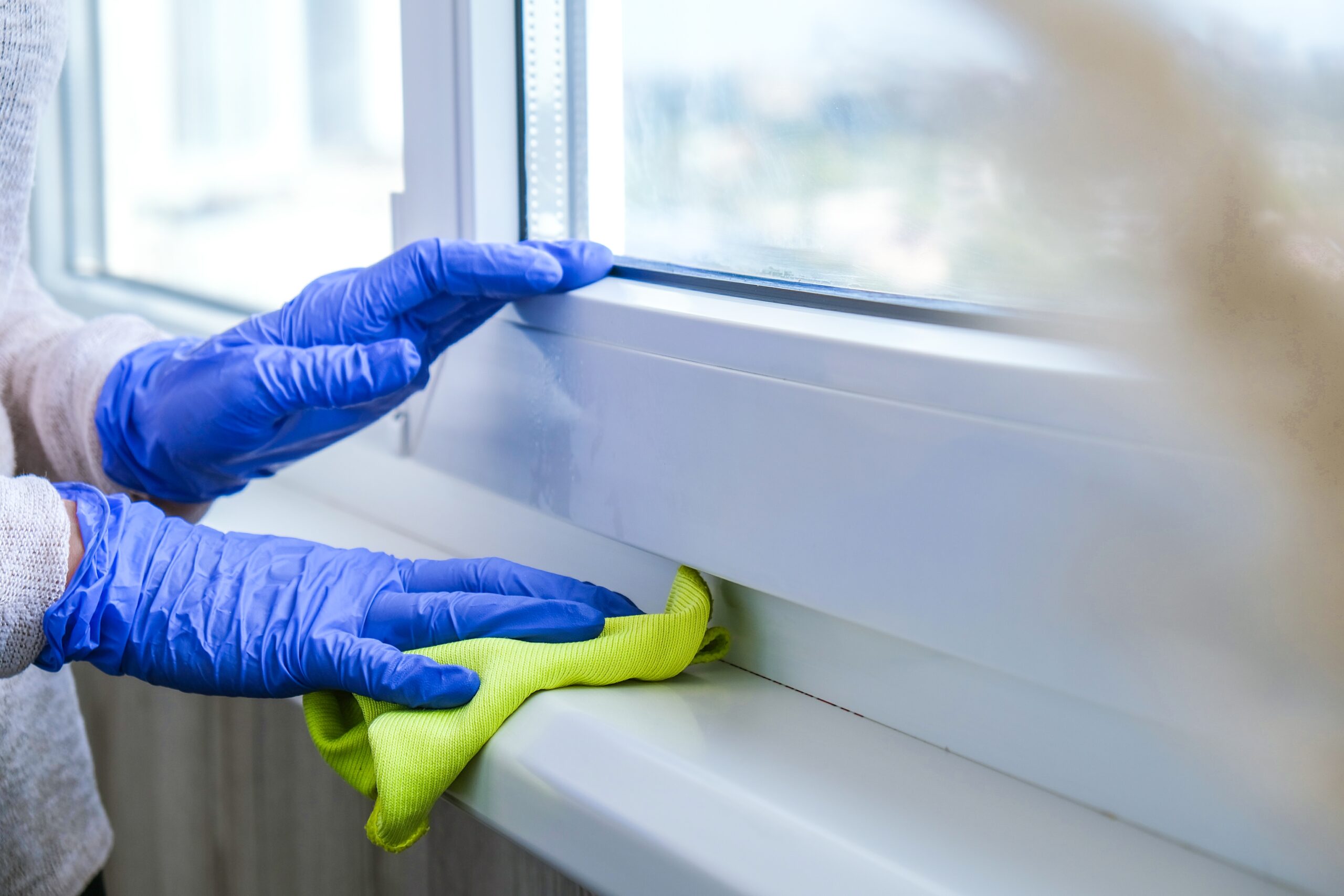 cleaning-the-windowsill-wiping-dust-by-blue-microf-2022-11-09-10-17-16-utc